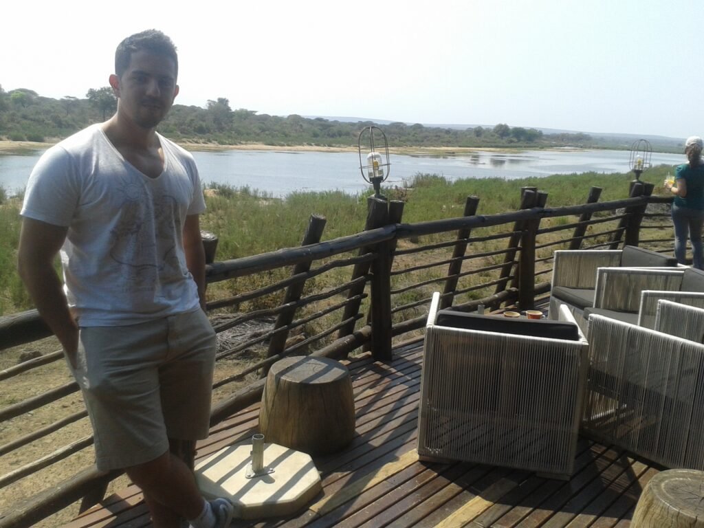 Me in Kruger Park, a top non-beach vacation for those who enjoy seeing wild animals and nature.