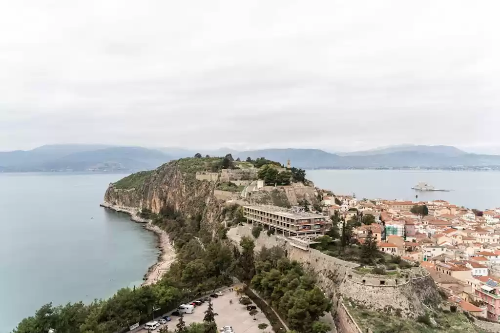 Explore the timeless beauty of Acronauplia Fortress overlooking Nafplio's coastline in Greece.