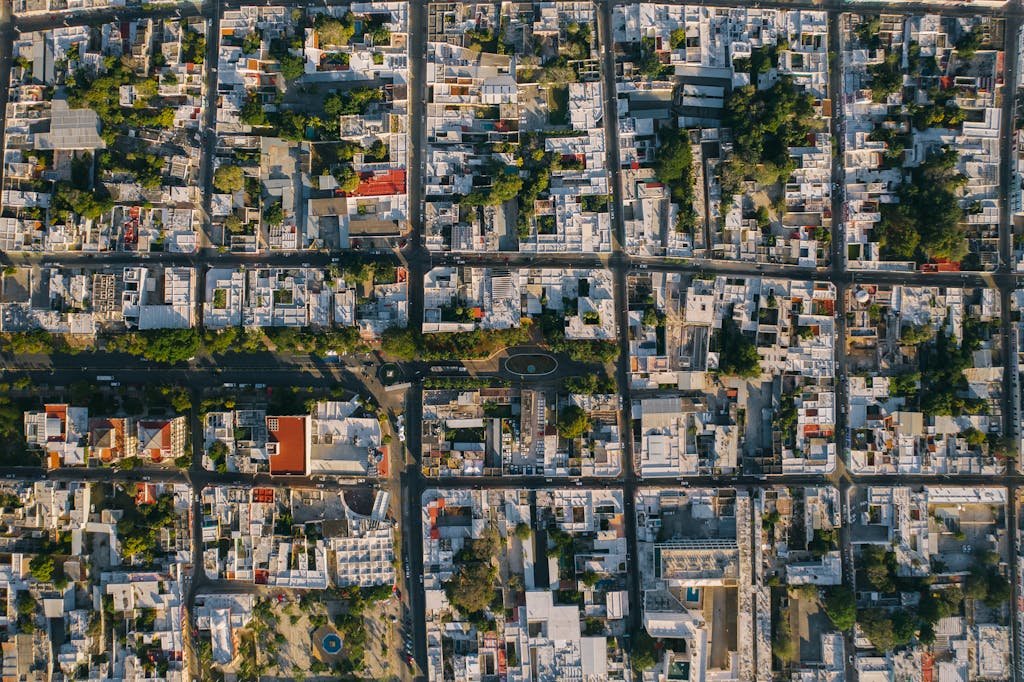 Bird's-eye view of Mérida, Mexico showcasing urban grid, architecture, and green spaces.