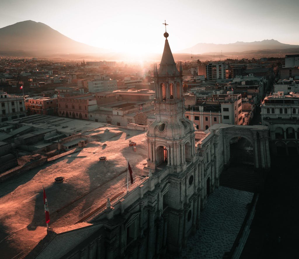 Breathtaking aerial view of Arequipa Cathedral at sunset, capturing Peru's historic architecture.