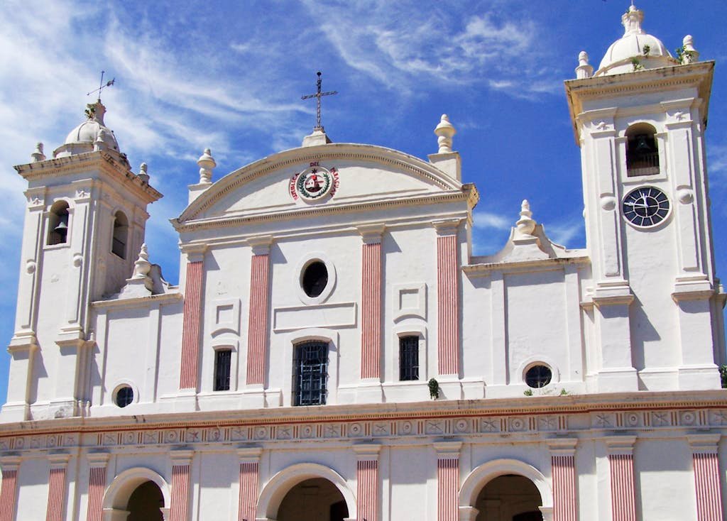 Front view of historic cathedral in Asunción, Paraguay with clear blue sky. Paraguay is one of the best countries to escape summer in America